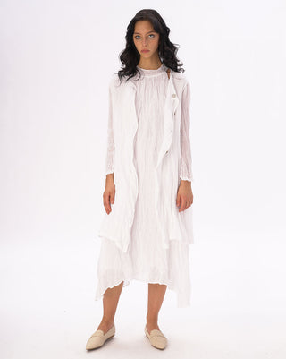 Woman wearing a white dress on a white background