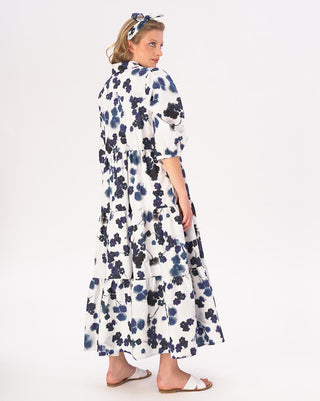 model wearing a floral print maxi dress by baci fashion against a white background 
