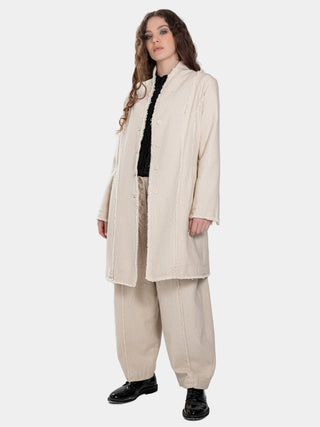 a model wearing a Spliced-Raw-Edge-Long-Jacket-full-view against a white background