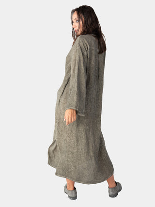 back view of a model wearing a sage green color dress