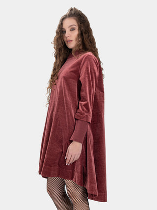 women wearing a red velvet outfit against a white background