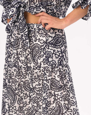 Black and white patterned outfit on a plain background
