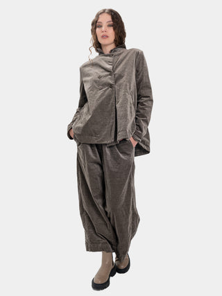 Woman wearing a gray outfit on a white background