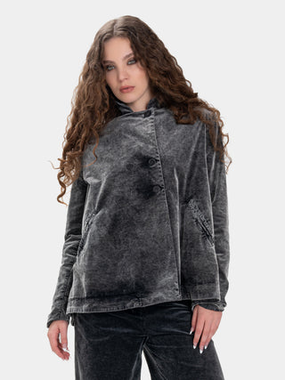 Woman wearing a gray textured jacket on a white background