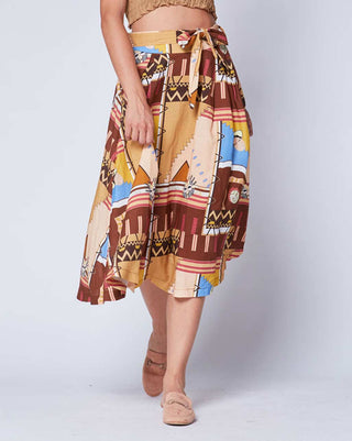 a women wearing an aztec printed circle skirt against a light grey background