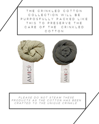 a display of 2 pieces of fabric rolled